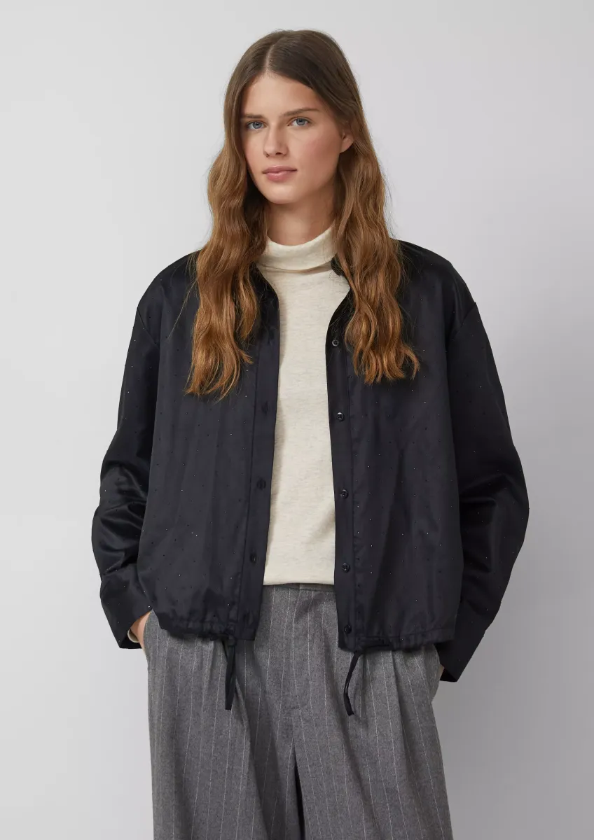 Hemdbluse mit Glitzersteinen und Schnürung am Saum