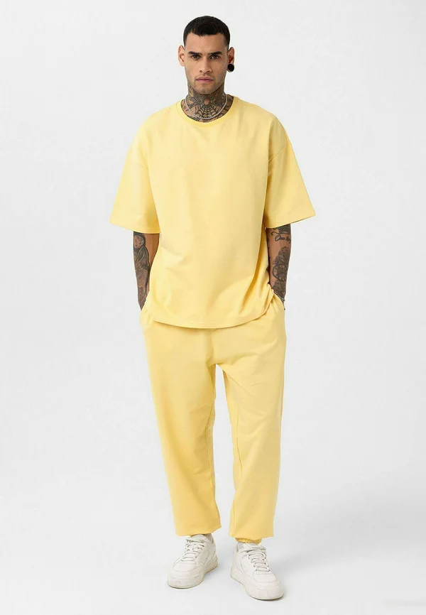ACHRAF SET - Jogginghose - yellow