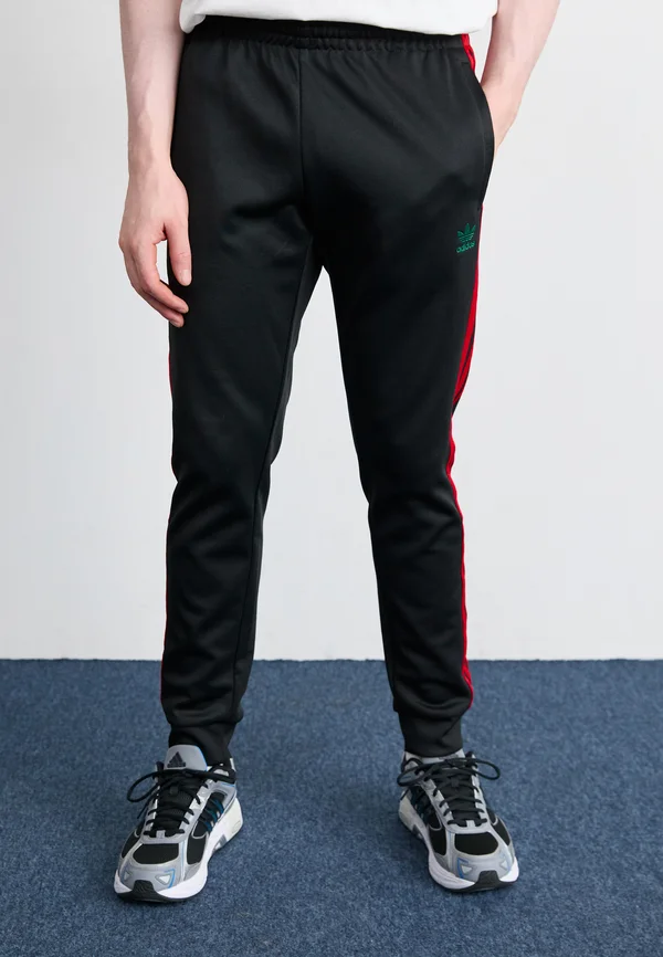 ADICOLOR CLASSICS SUPERSTAR TRACK PANTS - Jogginghose - black/better scarlet