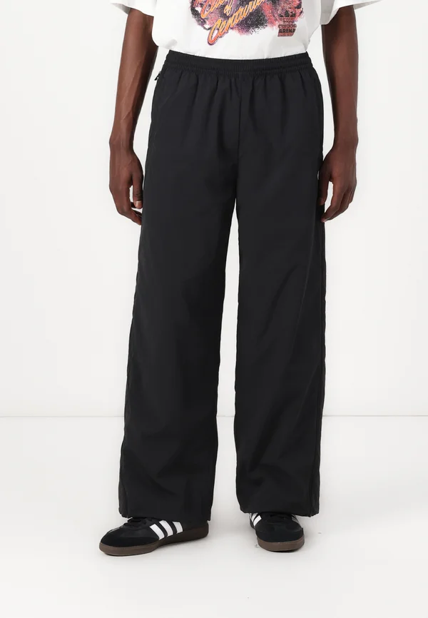 ADILENIUM SEASONAL 3 OVERSIZED SUPERSTAR TRACK - Jogginghose - black
