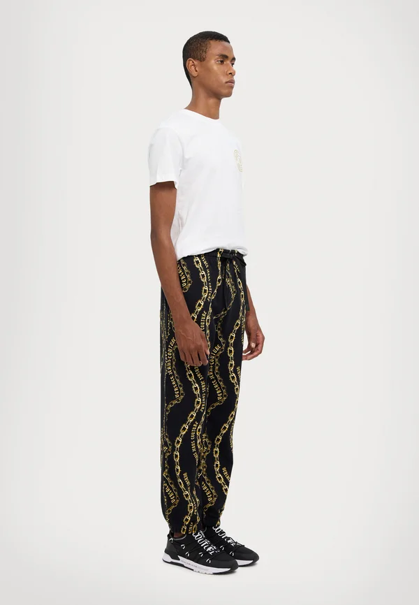 ALL OVER - Jogginghose - black/gold