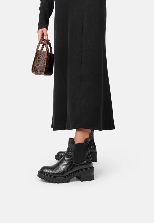AMY - Plateaustiefelette - black with animail print
