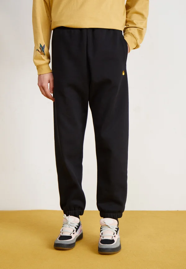 CHASE PANT - Jogginghose - black/gold