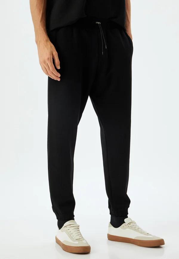 DRAWSTRING - Jogginghose - black