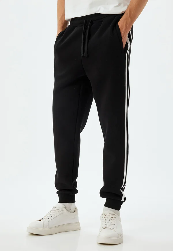 DRAWSTRING - Jogginghose - black