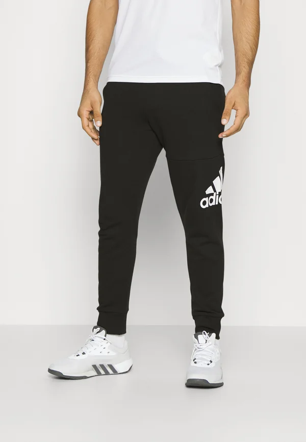 ESSENTIALS TAPERED CUFFED - Jogginghose - black