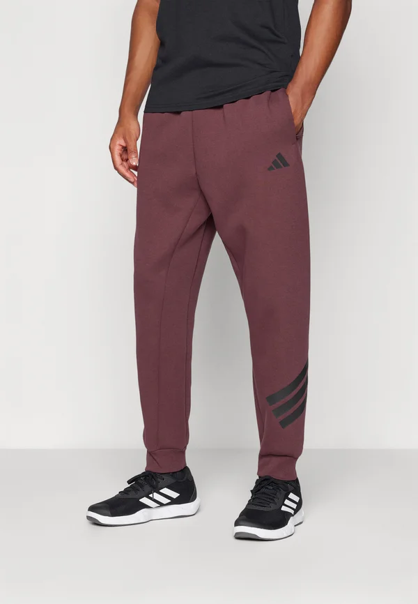 FUTURE ICONS THREE STRIPES - Jogginghose - aurora ruby