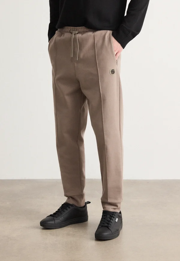 HADIKO - Jogginghose - light pastel green