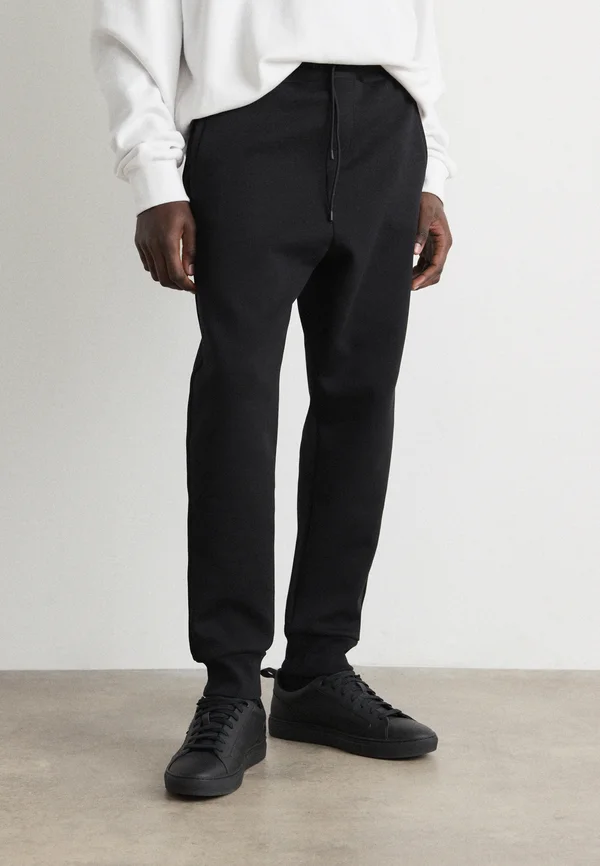 HADIKO TAPE - Jogginghose - black