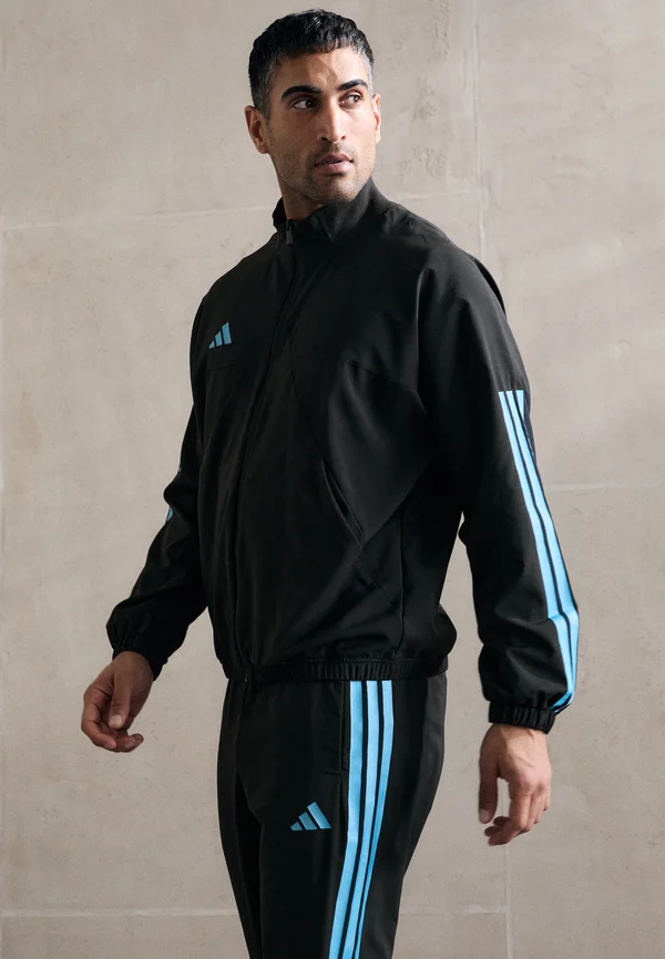 HOUSE OF TIRO WOVEN - Trainingsjacke - black/bright cyan