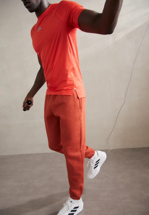 ICON FLEECE - Jogginghose - earthen orange light heather/earthen orange