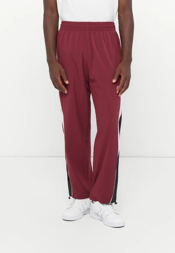 IN GAME TRACK PANT - Jogginghose - red