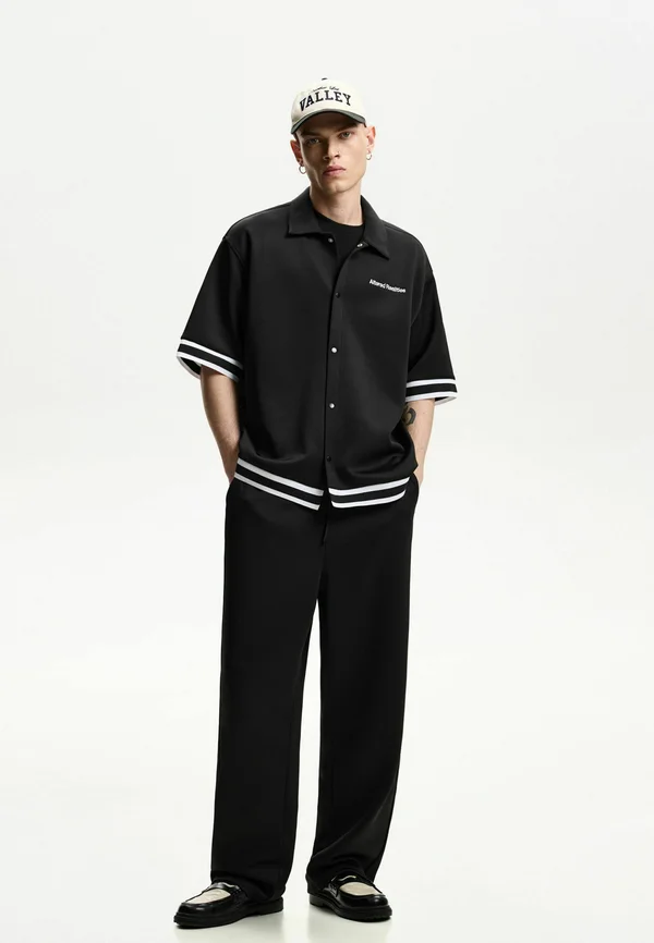 JOGGER-BAGGY - Jogginghose - black
