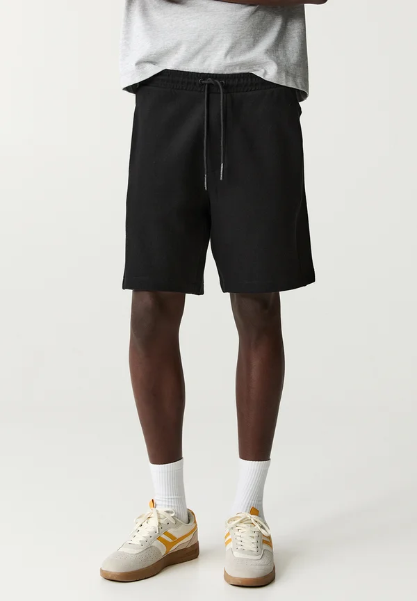 JOGGER - BERMUDA - Jogginghose - black