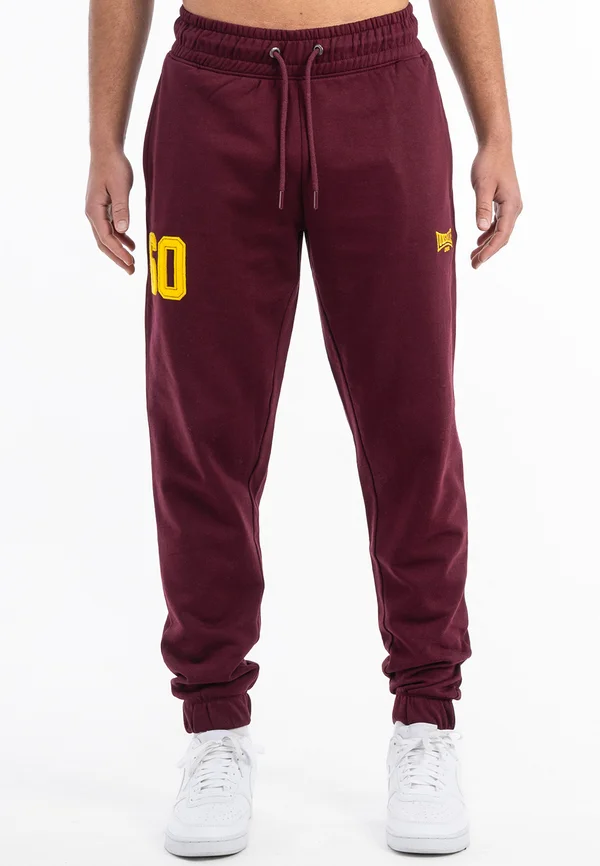 JOGGING NORMALE PASSFORM SUMBURGH - Jogginghose - oxblood yellow