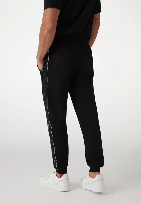 JOGGING SEITLICHES LOGO - Jogginghose - schwarz