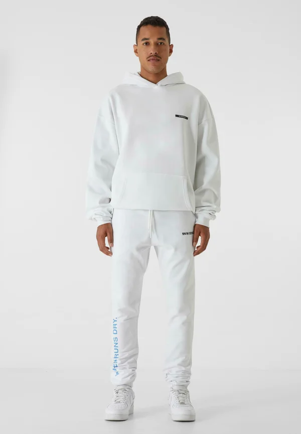 LEG PRINT - Jogginghose - white