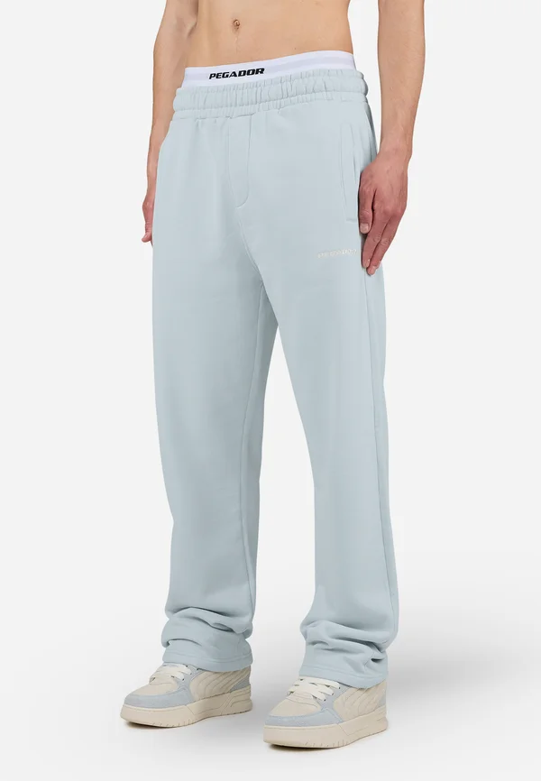 LOGO WIDE PANTS - Jogginghose - washed dream blue/white gum
