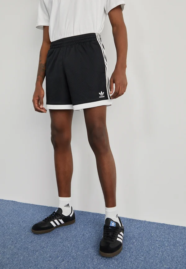 MOCK EYELET - Jogginghose - black