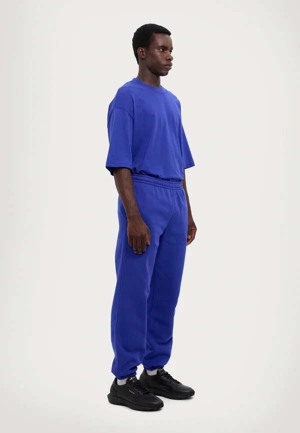 ORGANIC UNISEX - Jogginghose - bluing