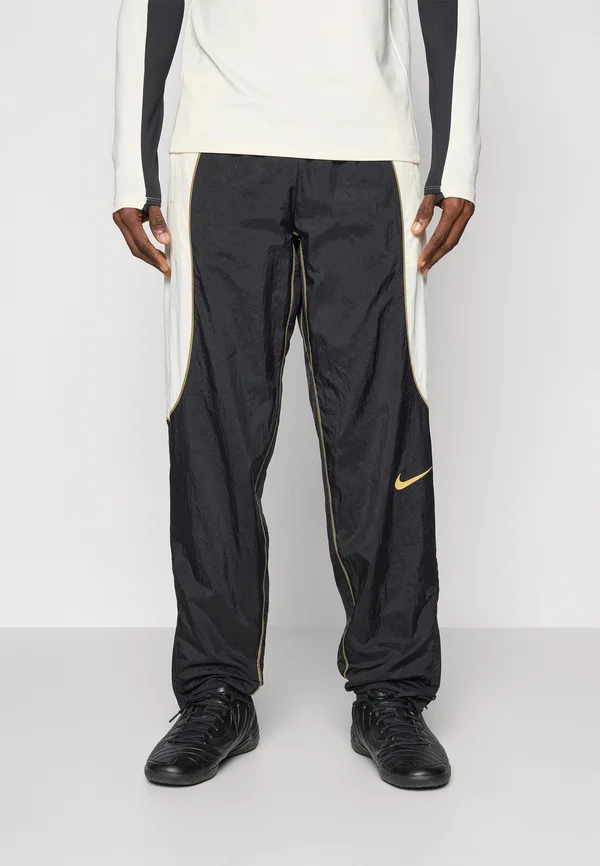 PANT - Jogginghose - black/pale ivory/jersey gold