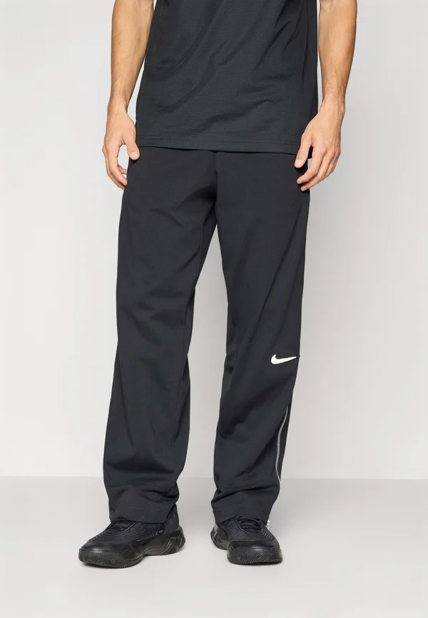 PANT NAOS - Jogginghose - black/pale ivory