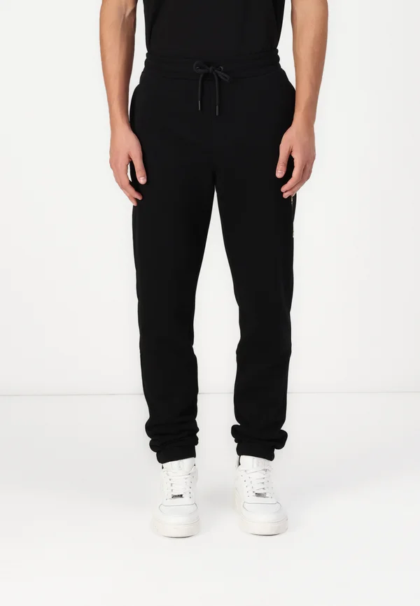 PANTS - Jogginghose - black