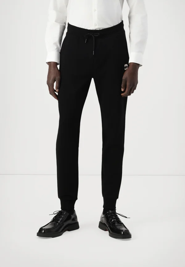 PANTS - Jogginghose - black