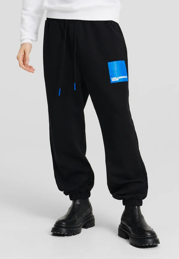RELAXED FIT - Jogginghose - black