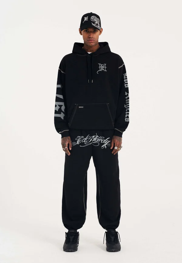 SCRIPT JOGGERS - Jogginghose - black