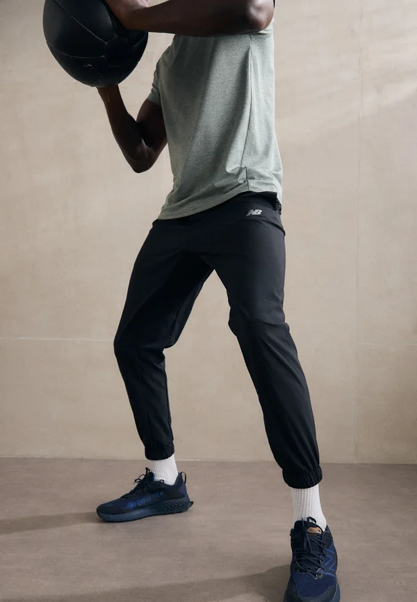SPORT ESSENTIALS - Jogginghose - black