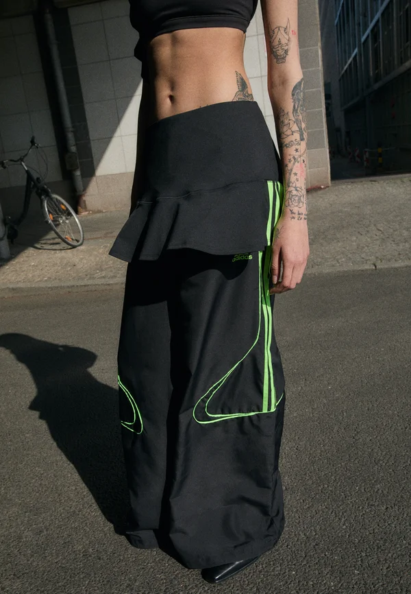 TEAMGEIST - Jogginghose - black/signal green