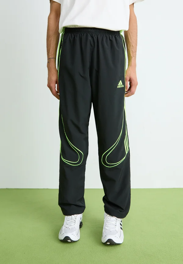 TEAMGEIST  - Jogginghose - black/signal green
