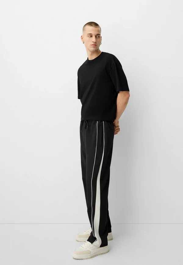 TECHNICAL - BAGGY  - Jogginghose - black