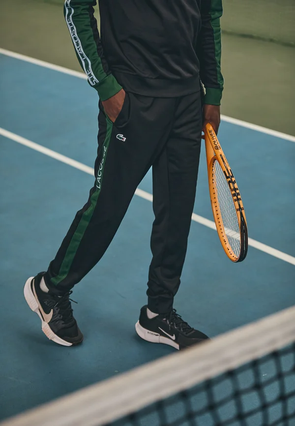 TENNIS PANT - Jogginghose - black/green