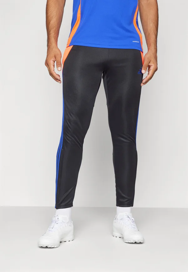 TIRO 24 SLIM - Jogginghose - black/app solar red/lucid blue