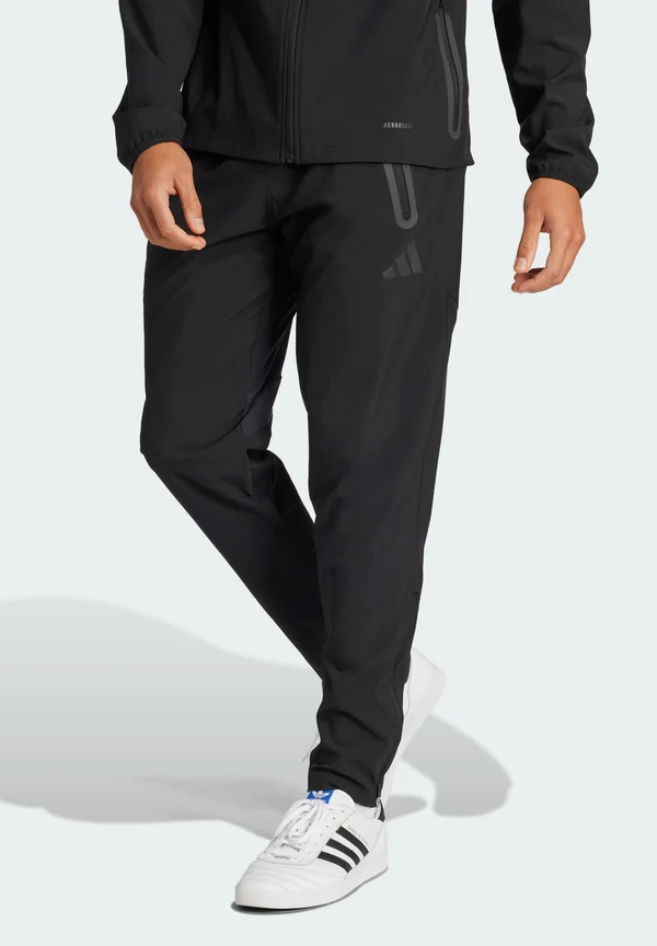TIRO 25 PRO VIS TECH TRAVEL PANTS - Jogginghose - black