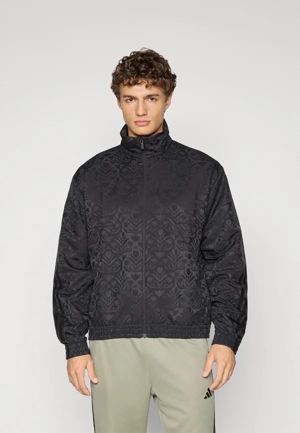 TIRO - Trainingsjacke - black