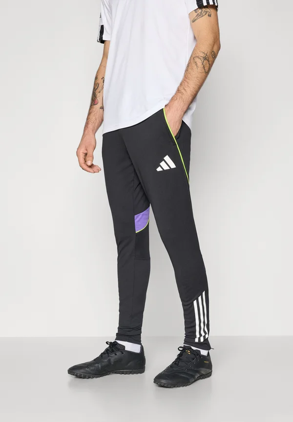 TIRO25C TRAINING PANT - Jogginghose - black/purple rush