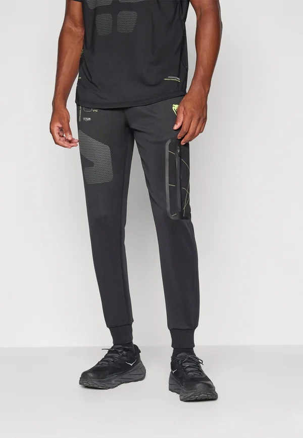 TRAINING CAMP JOGGERS - Jogginghose - black/neon green