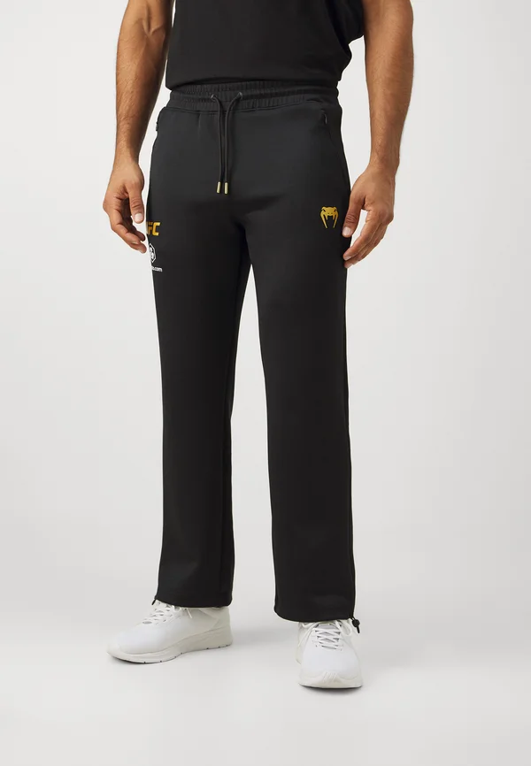 UFC AUTHENTIC FIGHT NIGHT 4.0 MENS JOGGERS - Jogginghose - black/gold