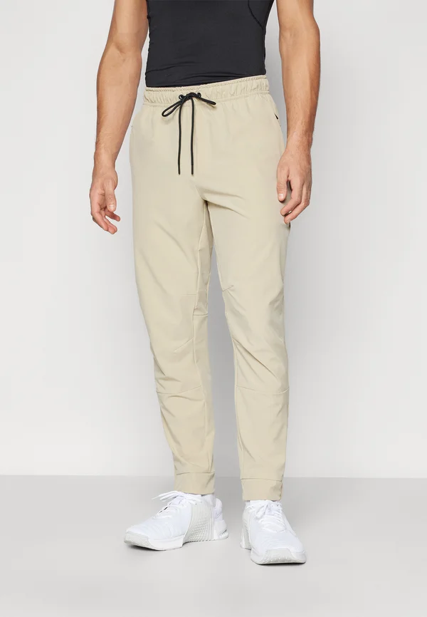 UNLIMITED  - Jogginghose - desert khaki/black