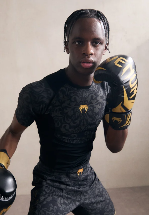 UNMATCHED TOPURIA EDITION RASHGUARDS - Sport T-Shirt - black/antique gold