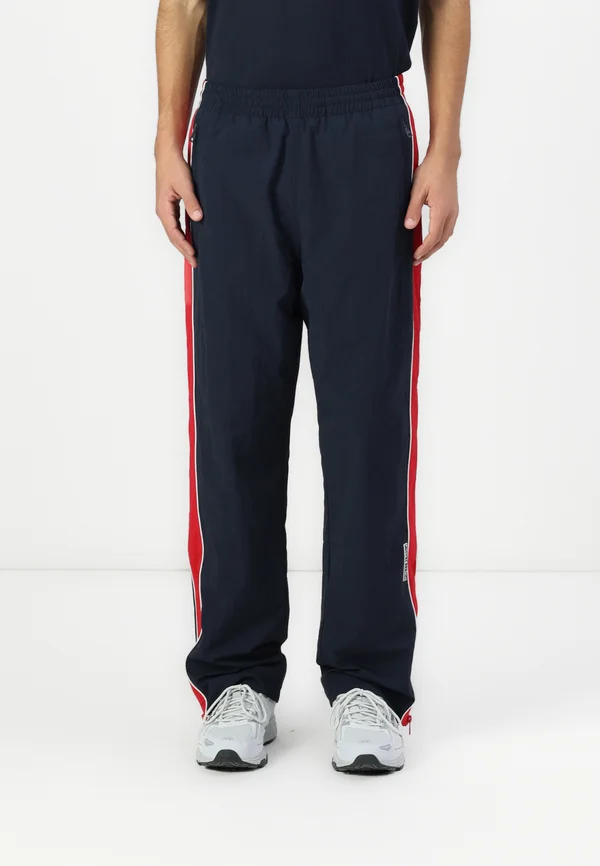 WINDBRAKER PANT - Jogginghose - daring ocean